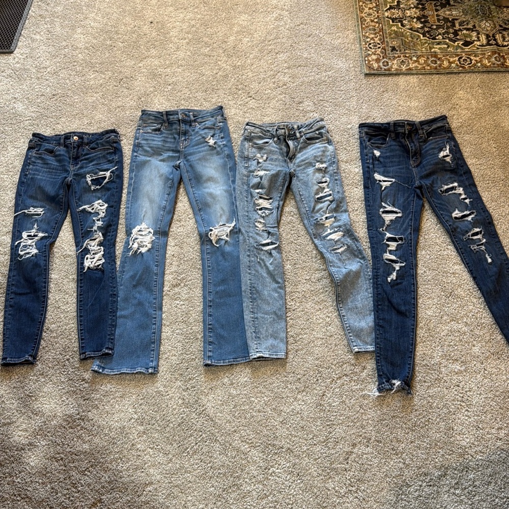 Four pair American Eagle jeans. Sold together.